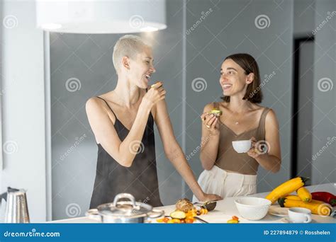 lesbian couple eating breakfast at kitchen stock image image of cooking meal 227894879