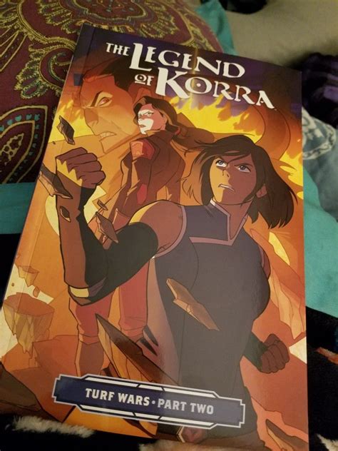 The Legend Of Korra Book Sitting On Top Of A Bed