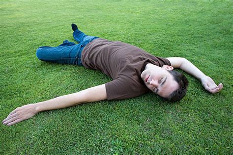 Best Man Laying On Ground Stock Photos Pictures And Royalty Free Images