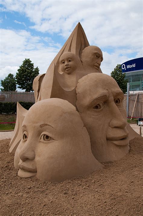Sandsation 10 Heads Out Of The Sand Sand Sculpture By