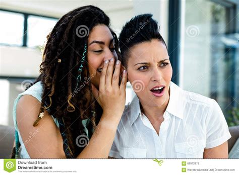 Lesbian Couple Whispering In Ear Stock Image Image Of Curly Bonding