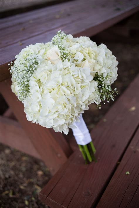 Elegant yet hearty, hydrangeas not only provide a beautiful base for floral arrangements, they stand just fine on their own. DIY White Hydrangea and Baby's Breath Bouquet