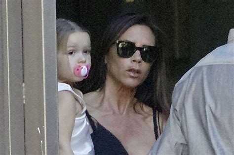 Victoria And David Beckhams Daughter Harper Photographed Sucking A