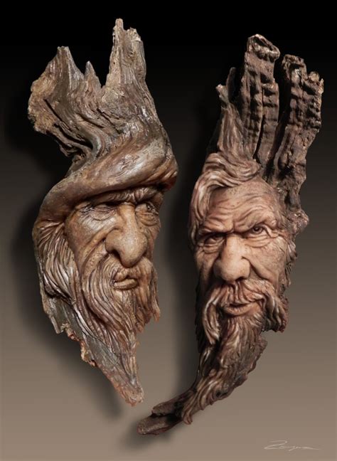Two Sculptures Of Mens Heads With Long Hair And Beards