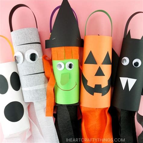 Halloween Crafts Made Out Of Toilet Paper Rolls With Faces On Them And