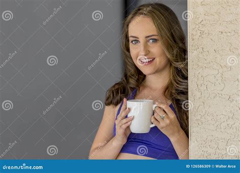 lovely brunette model enjoying a drink at home stock image image of fashionable intimacy