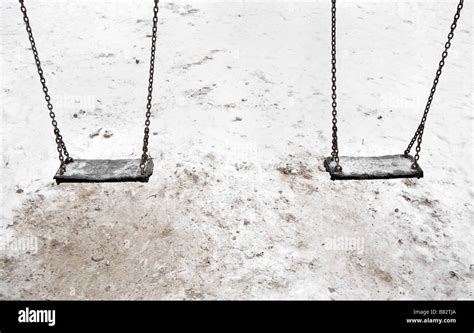 Empty Swings In Snow Stock Photo Alamy