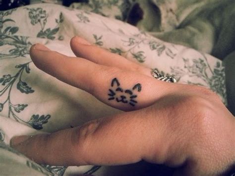 Cats have been with us since the beginning of time and there are many people who absolutely love cats. Image result for finger tattoos cat | Cat tattoo simple ...