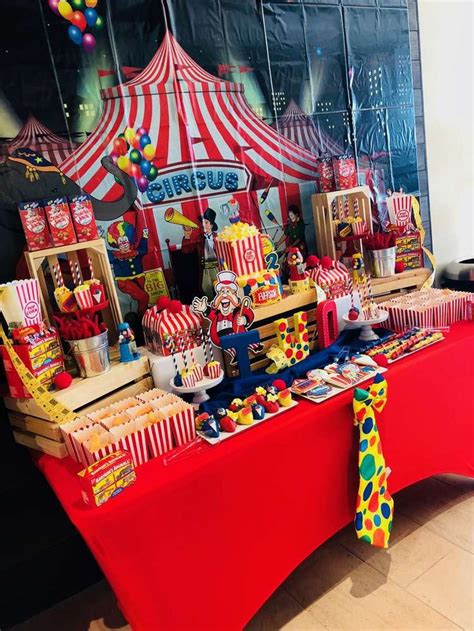 A Circus Themed Birthday Party With Red Table Cloth
