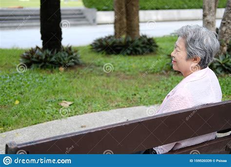 Old Elder Woman Resting In Garden Elderly Female Relaxing Outdoors