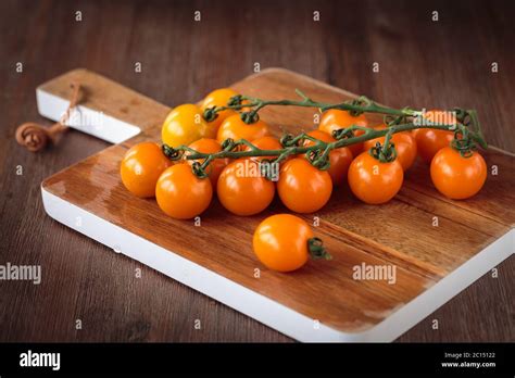 Fresh Orange Cherry Tomatoes Stock Photo Alamy