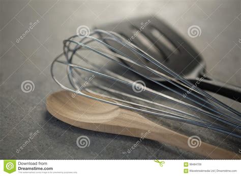 Close Up Of Wooden Spoon With Wire Whisk And Spatula Stock Image