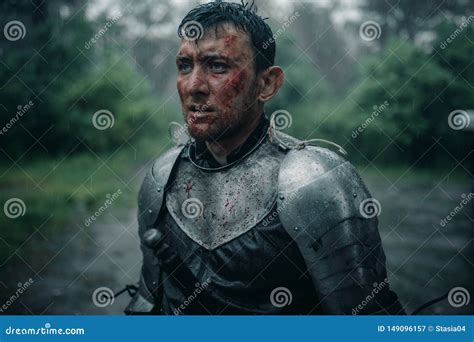 Portrait Of Young Man In The Image Of A Medieval Knight With Blood And