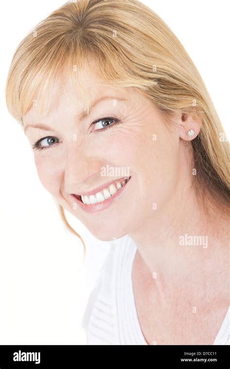 Studio Portrait Head Shot Of A Happy Smiling Attractive Middle Aged Blonde Woman With Perfect