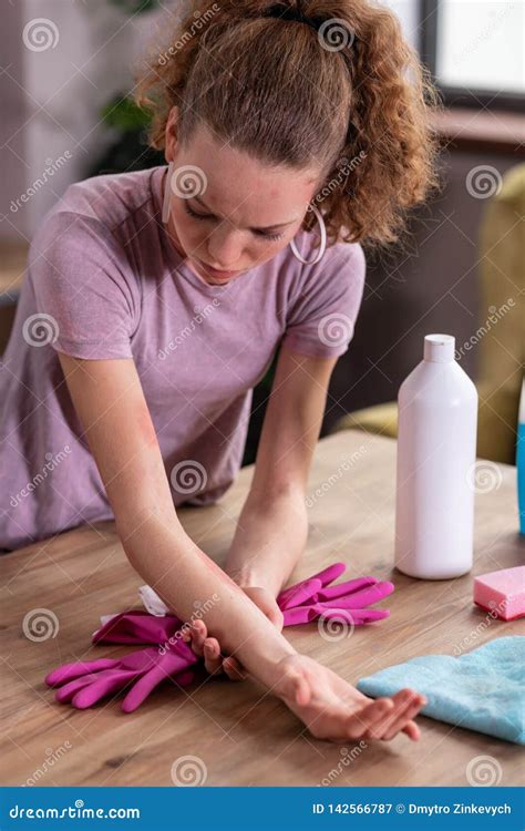 Upset Curly Haired Housewife Having Problems With Her Skin Stock Image