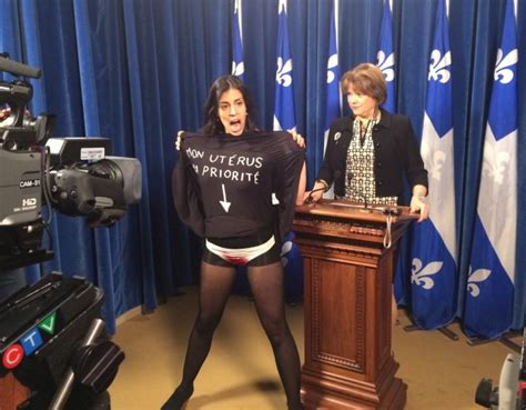 Topless Woman Crashes Quebec Ministers News Conference Ctv News
