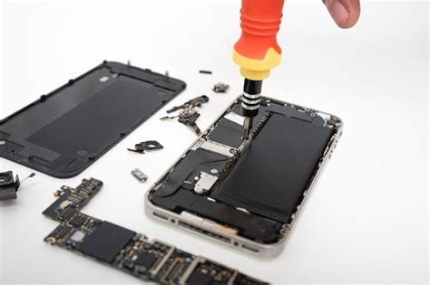 Premium Photo Technician Repairing Inside The Smartphone Motherboard