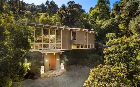 Midcentury Hollywood Hills Home Lists With Two Storey Living Room The