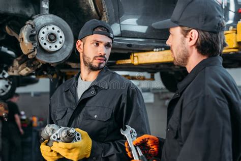 Auto Mechanics Working With Car And Tools Stock Image Image Of Work