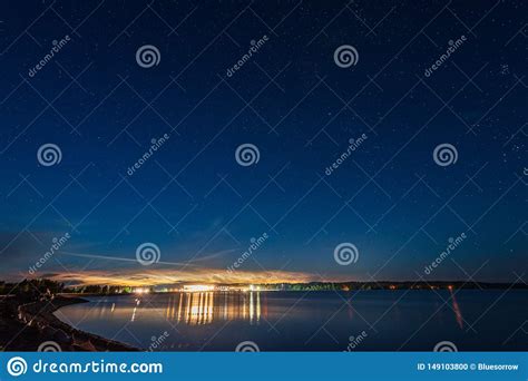 Night Sky With Stars And Clouds In Long Exposure Shot Stock Photo