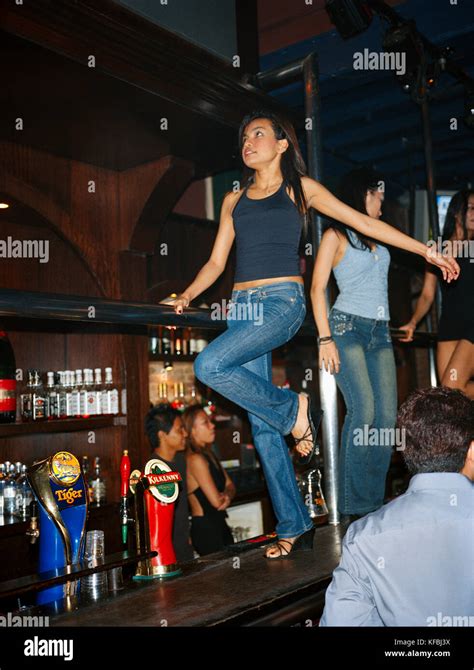 Singapore Female Bartenders Dancing In Cu Nightclub Bar Stock Photo Alamy
