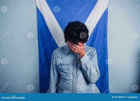 Depressed Man Standing In Front Of Scottish Flag Stock Photo Image Of