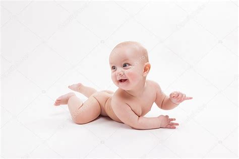 Naked Baby On A White Background Smiling And Looking At The Came Stock