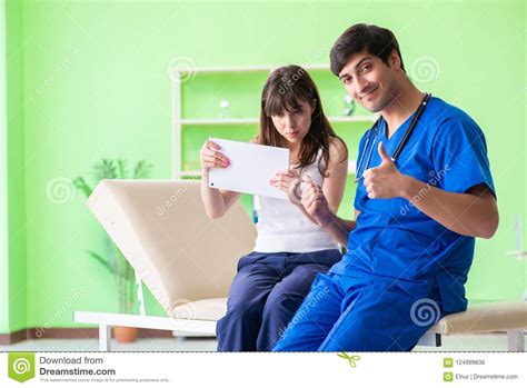 The Female Patient Visiting Male Doctor In Medical Concept Stock Photo