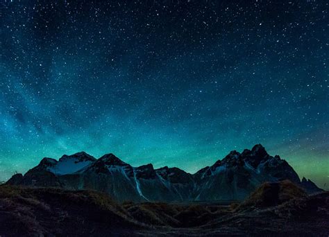 A Beautiful Green Colour Appearing In The Night Sky Behind The