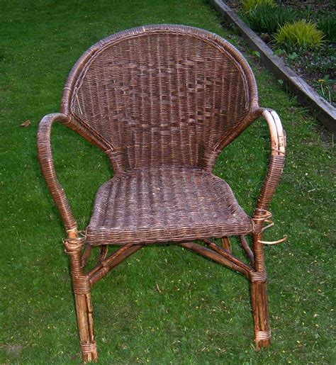 Rayner brown wicker chair $149.99. Brown rattan chair; needs a little re-wrapping. Chair is ...