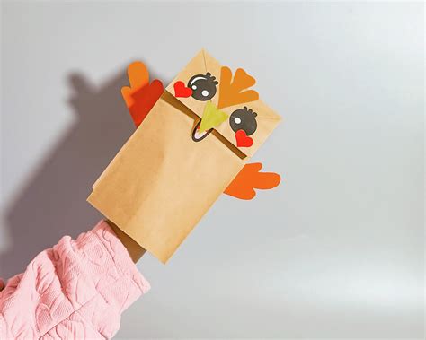 用纸袋做小鸟创意手工方法 有趣的手偶玩具的做法图片💛巧艺网