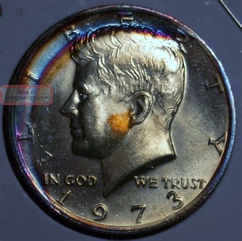 One dollar is divided into 100 cents (symbol: 1973 Kennedy Half Dollar