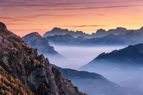 Mountains In Fog At Beautiful Sunset Featuring Mountain Rock And Fog