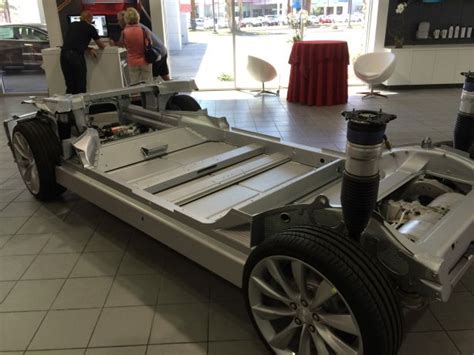The Car Is Being Displayed At The Showroom For People To See And Take