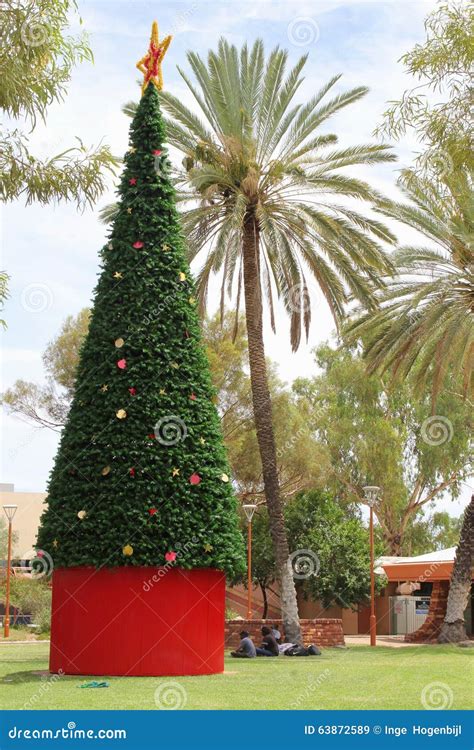 Aboriginals Around A Decorated Christmas Tree In Alice Springs