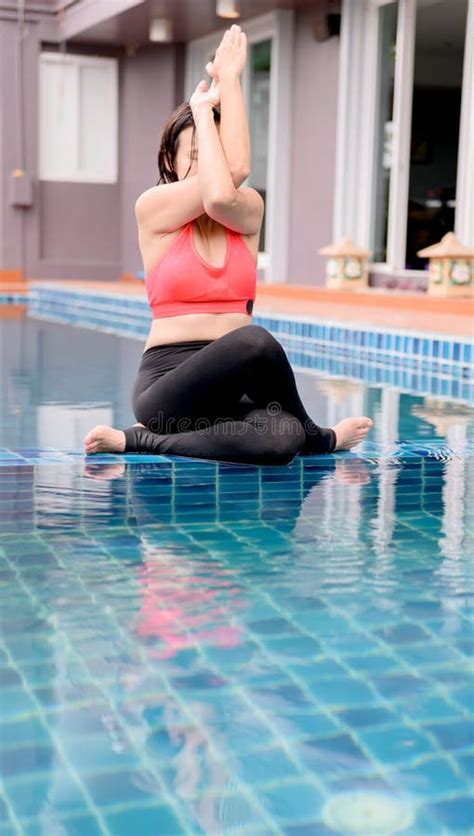 Asian Woman Yoga Breathing And Meditation Alone At Swimming Pool At Home Outdoor Exercise And
