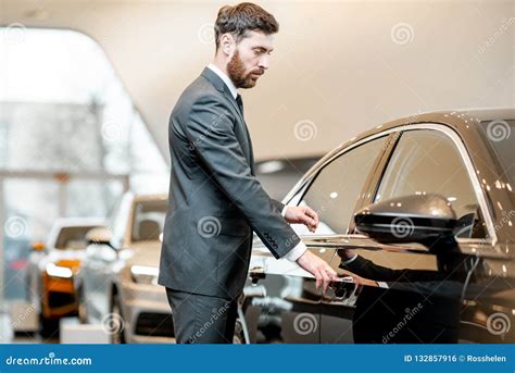 Businessman Choosing Car In The Showroom Stock Photo Image Of Cars