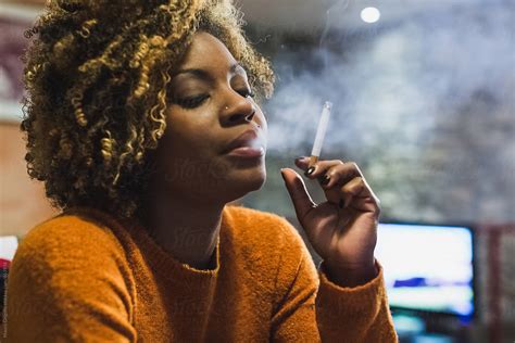 Brazilian Woman Smoking A Cigarette At Home By Mauro Grigollo