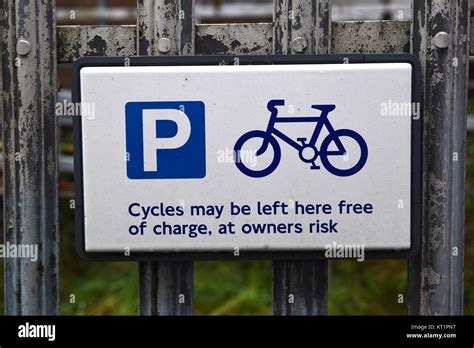Blue And White Cycle Parking Sign On A Steel Fence Stock Photo Alamy