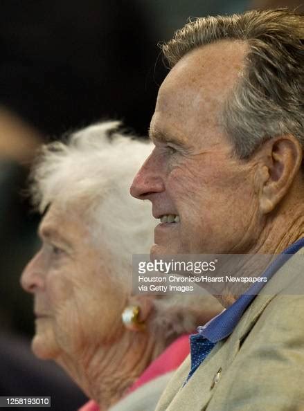 former president george h w bush and his wife barbara watch the news photo getty images