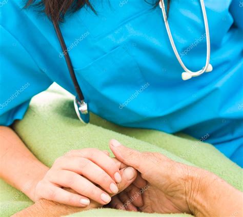 Nurse Holding Elderly Womans Hand — Stock Photo © Lighthunter 76741501