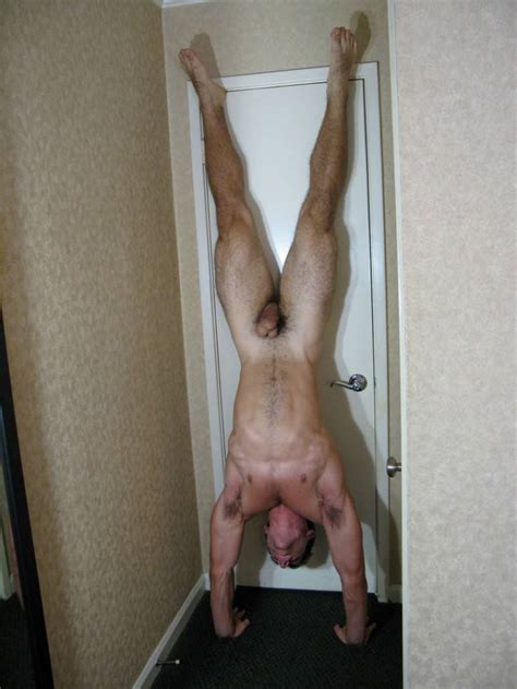 Naked Man Hanging Upside Down From Window Kicks Himself Sexiezpix Web Porn