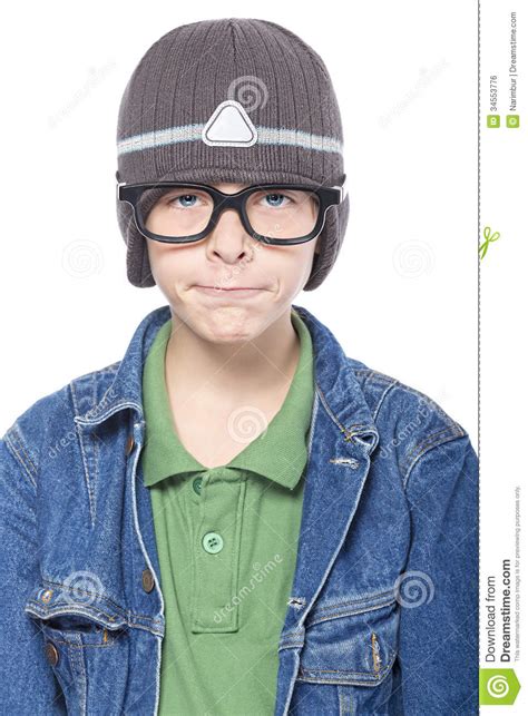 Nerd Looking Teenage Boy With Glasses And Cap Looking Funny Is