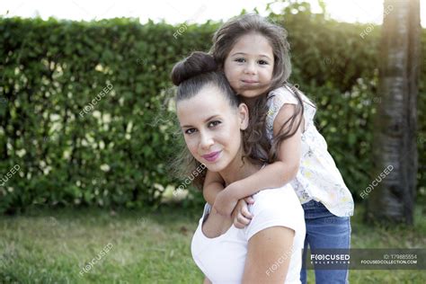 Little Girl Hugging Her Mother In Park — Meadow Woman Stock Photo