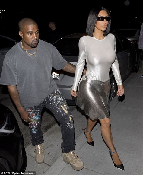 kim kardashian flaunts newly gym honed figure in a skintight bodysuit for date with kanye