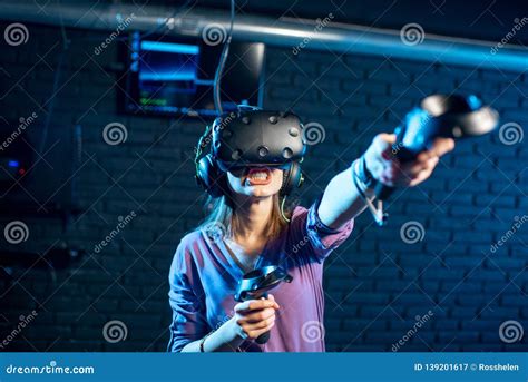 Woman Playing Game With Virtual Reality Headset In The Club Stock Image