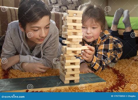 Boy Play Jenga Game Together Children Playing At Home Intrerior