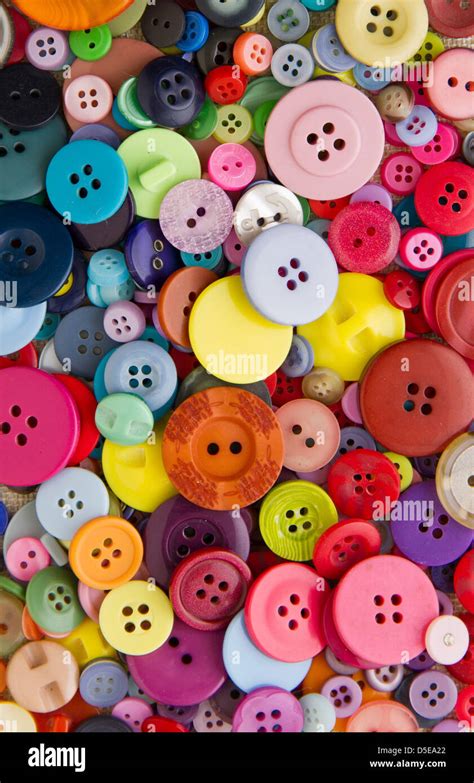 Many Mixed Brightly Coloured Sewing Or Clothing Buttons Filling The