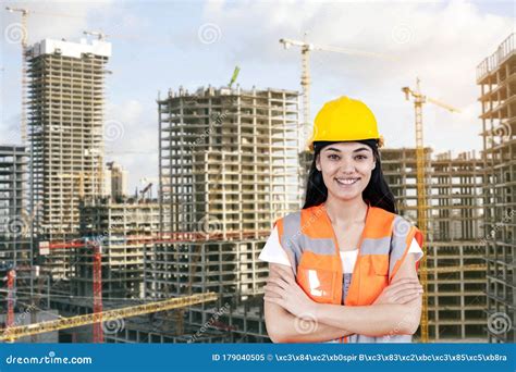 Young Woman Civil Engineer On Construction Building Background