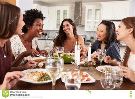 Between cooking and keeping your home presentable, you have to keep the dinner lively and entertaining. Group Of Female Friends Enjoying Dinner Party At Home ...